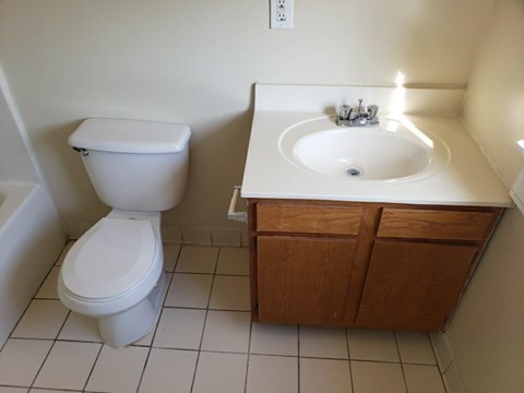 a bathroom with a toilet and a sink